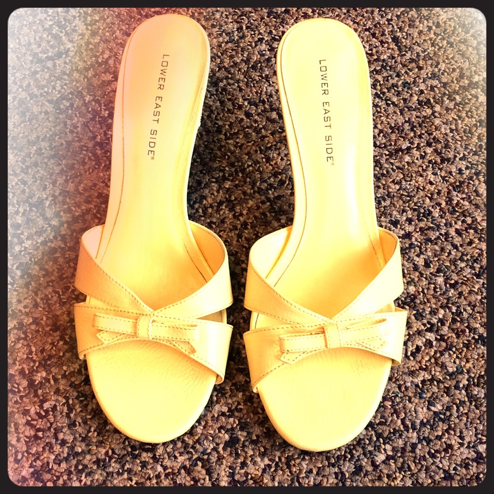 Pale yellow slip ons